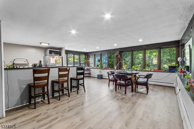 a living room filled with furniture and a large window