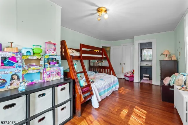 a room with two beds and a window