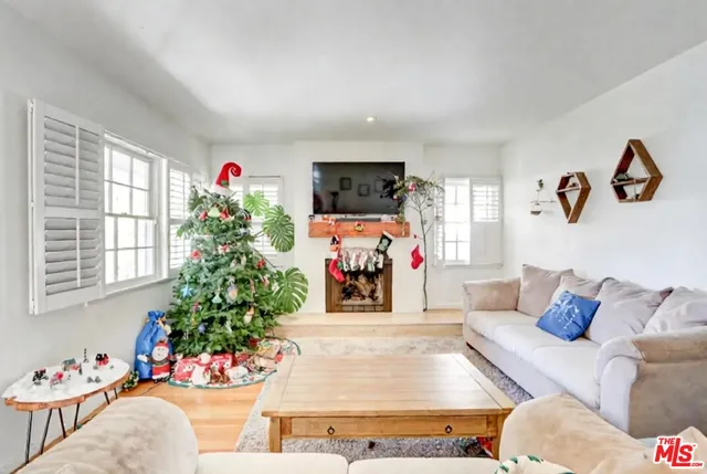 a view of a dining room with furniture and a window