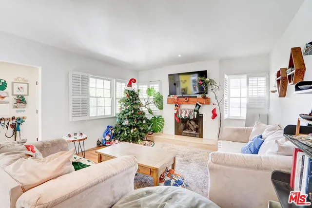 a kitchen with stainless steel appliances a stove a sink a refrigerator and cabinets