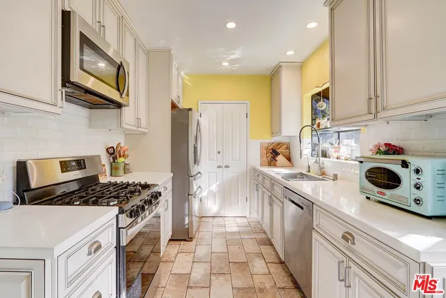a view of a porch with furniture and wooden floor