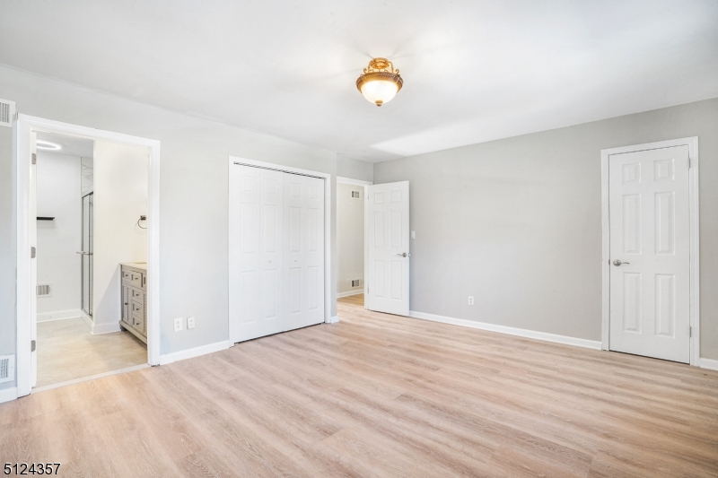 1 Tempe Wick Road, Unit A Mendham, NJ 07945 - Photo 13 of 22 a view of an empty room and window