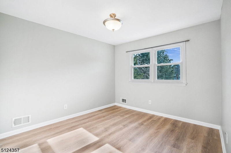 1 Tempe Wick Road, Unit A Mendham, NJ 07945 - Photo 15 of 22 a view of an empty room with a window