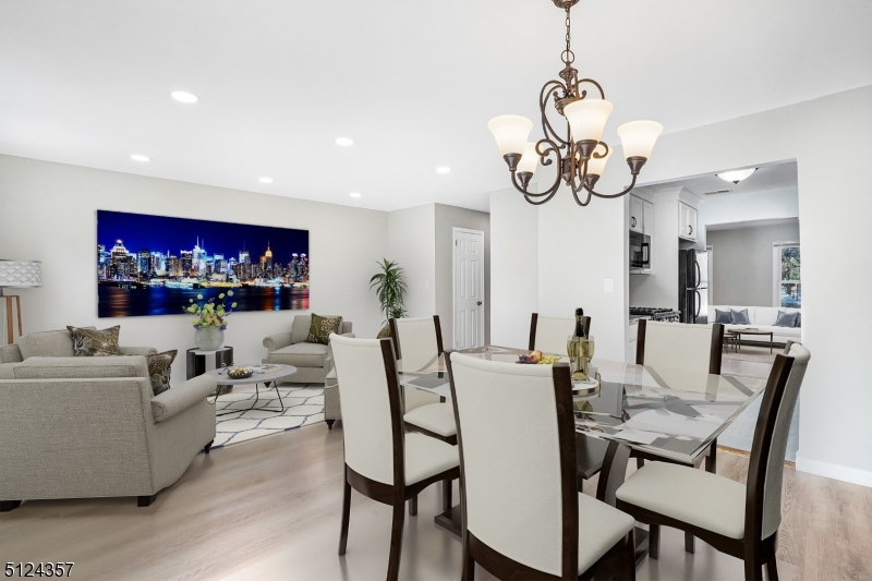 1 Tempe Wick Road, Unit A Mendham, NJ 07945 - Photo 6 of 22 a view of a dining room with furniture wooden floor and chandelier