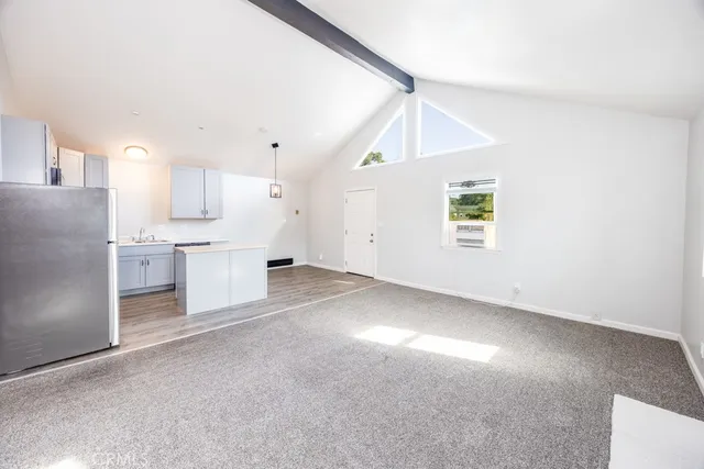 a view of a kitchen with a sink cabinets and a window