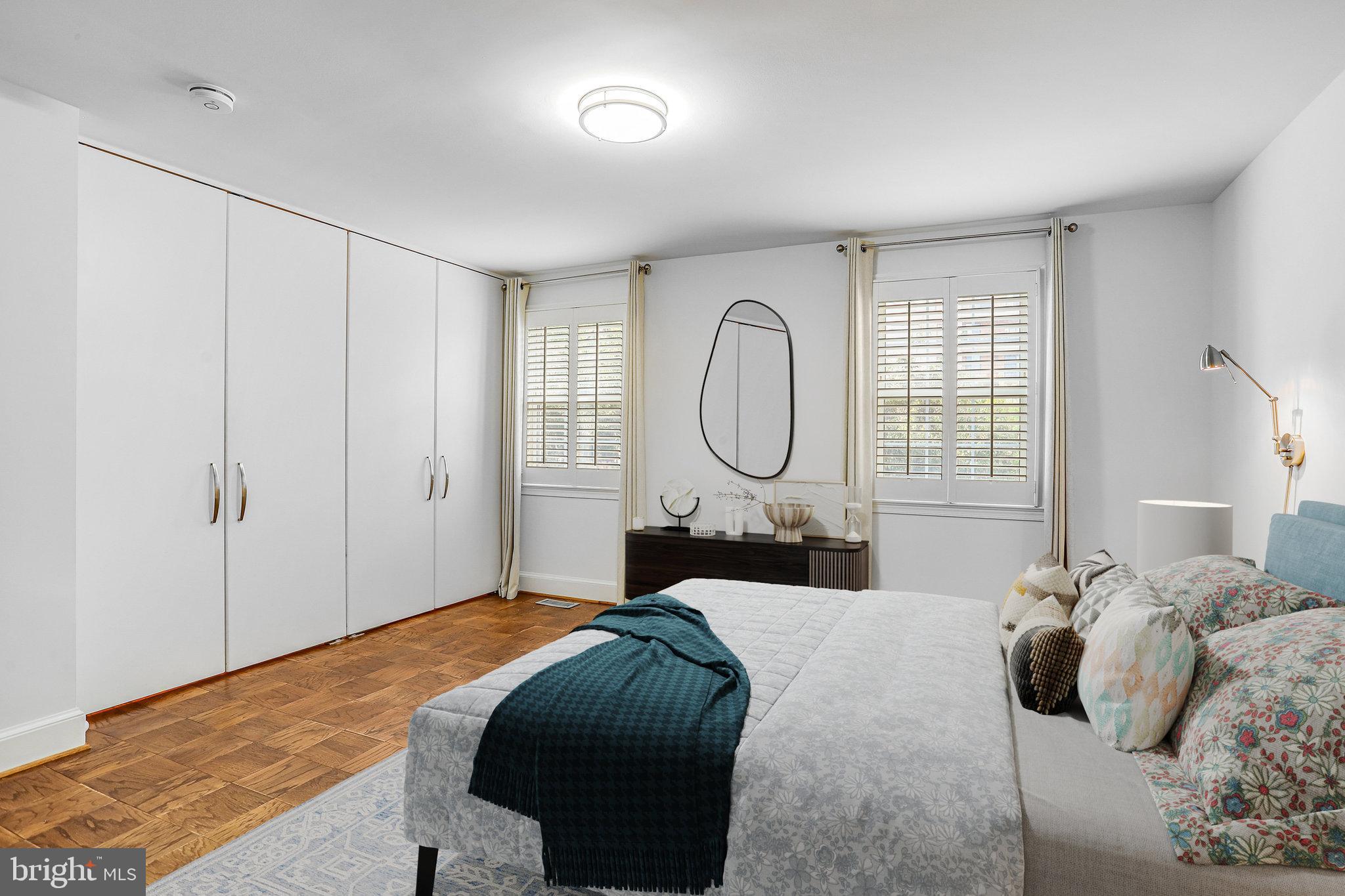 3275 Sutton Place Northwest, Unit A Washington, DC 20016 - Photo 13 of 27 a bedroom with a large bed and a window