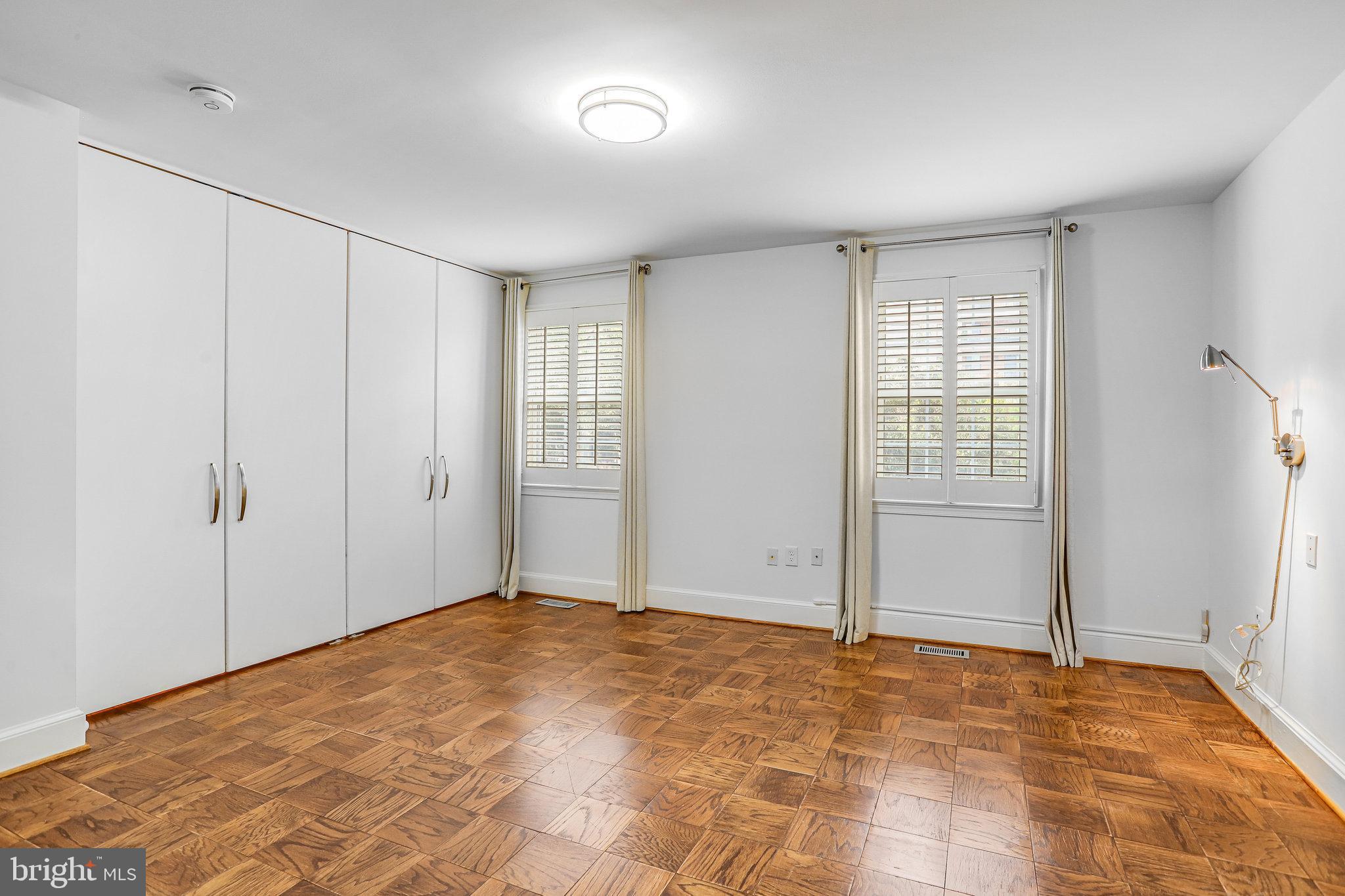 3275 Sutton Place Northwest, Unit A Washington, DC 20016 - Photo 14 of 27 a view of an empty room with window and closet area