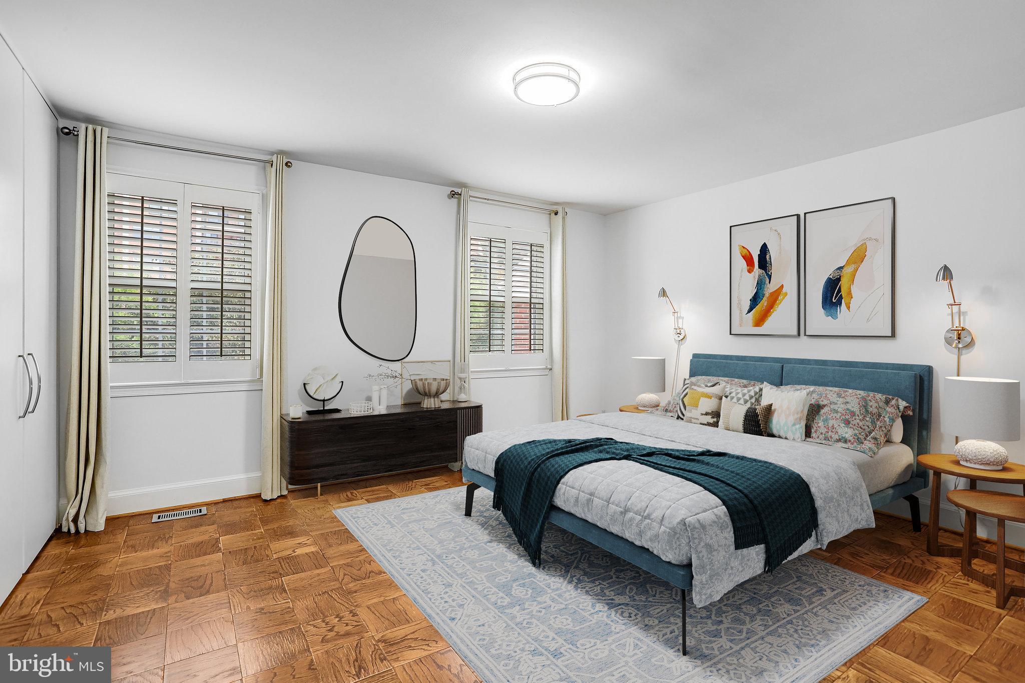 3275 Sutton Place Northwest, Unit A Washington, DC 20016 - Photo 15 of 27 a spacious bedroom with a bed a dresser next to a window
