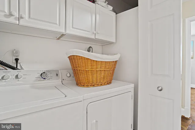 a bathroom with a sink and cabinets