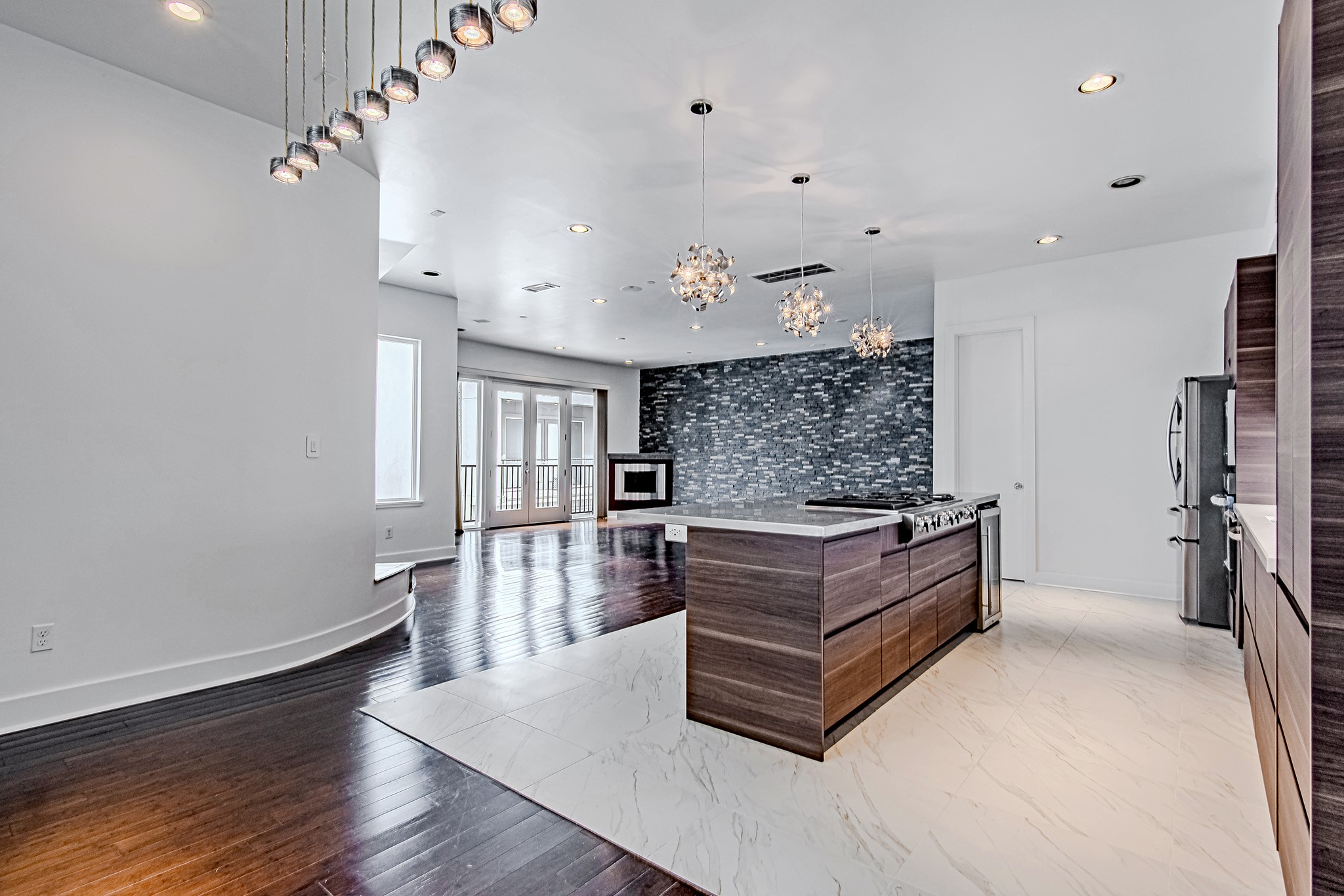2025 Colquitt Street, Unit E Houston, TX 77098 - Photo 12 of 29 Seamless transition between kitchen and living areas for an open, airy feel.