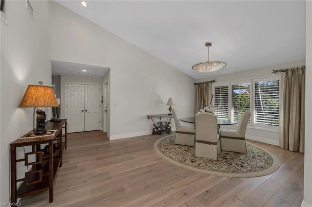 a view of a livingroom with furniture and a wooden floor