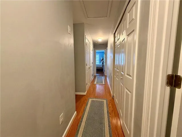 a view of a hallway with a door