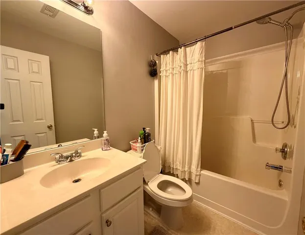 a bathroom with a sink a toilet and a bathtub