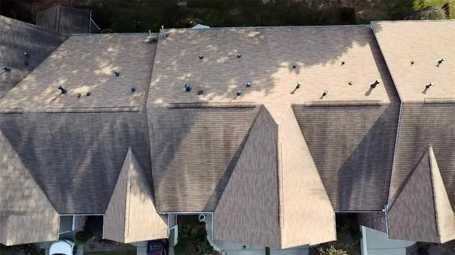 an aerial view of residential houses with outdoor space