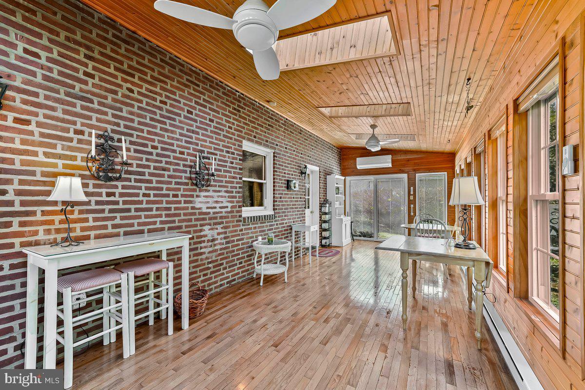428 Wheatsheaf Road Springfield, PA 19064 - Photo 15 of 40 a balcony with furniture and wooden floor