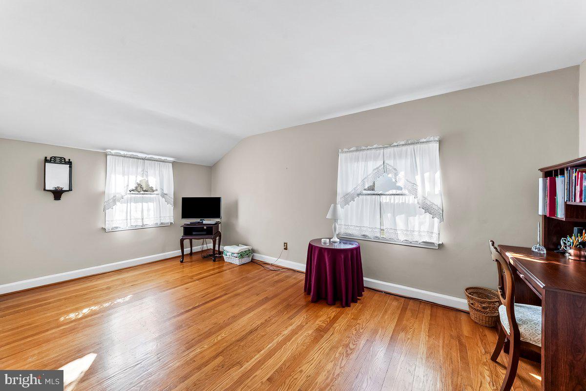 428 Wheatsheaf Road Springfield, PA 19064 - Photo 27 of 40 a view of an empty room with a window and wooden floor