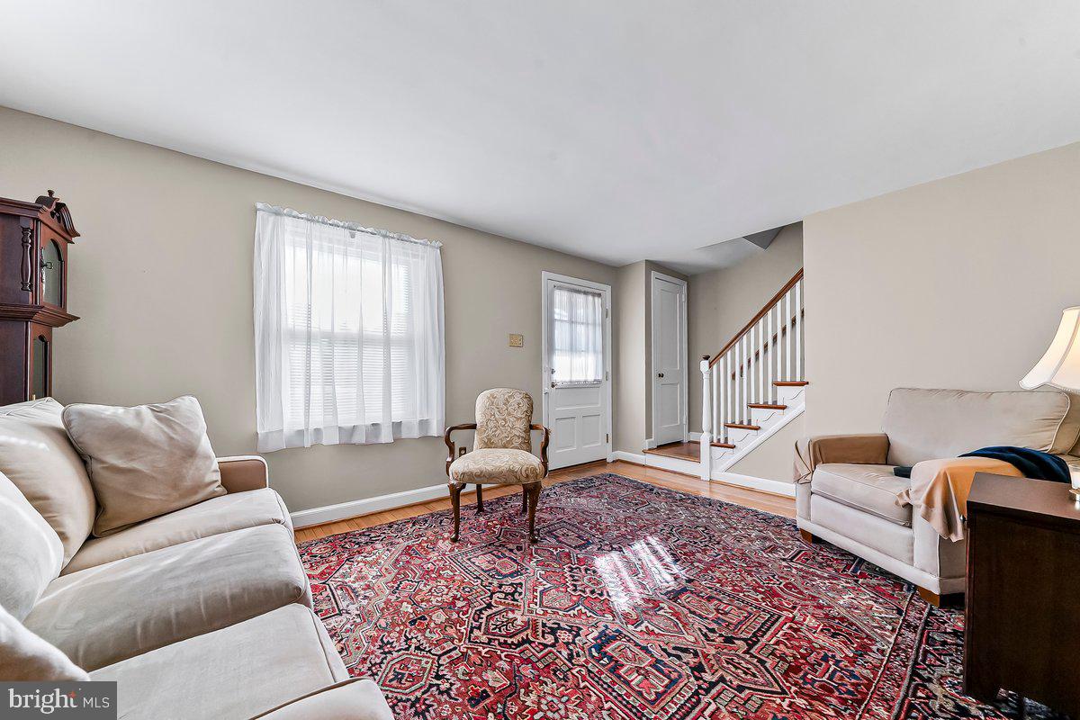 428 Wheatsheaf Road Springfield, PA 19064 - Photo 9 of 40 a living room with furniture and a rug