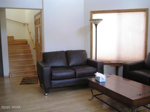 1922 Artist Draw Road Heber, AZ 85928 - Photo 13 of 63 a living room with furniture a lamp and a window