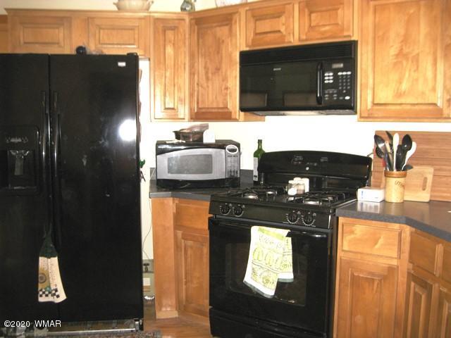 1922 Artist Draw Road Heber, AZ 85928 - Photo 17 of 63 a kitchen with a sink and a refrigerator