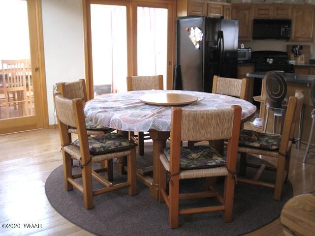 1922 Artist Draw Road Heber, AZ 85928 - Photo 20 of 63 a dining room with furniture and a flat screen tv
