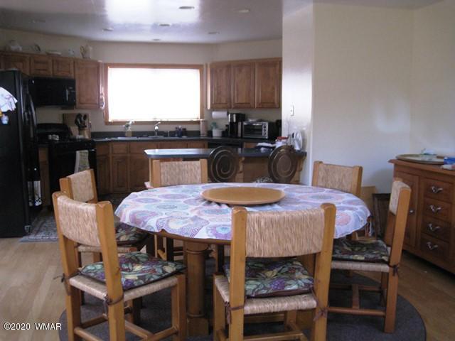 1922 Artist Draw Road Heber, AZ 85928 - Photo 22 of 63 a large kitchen with dining table and chairs