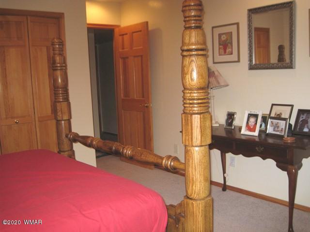 1922 Artist Draw Road Heber, AZ 85928 - Photo 41 of 63 a bedroom with a bed and wooden floor