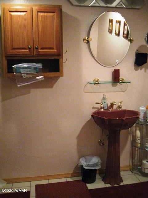 1922 Artist Draw Road Heber, AZ 85928 - Photo 45 of 63 a bathroom with a sink and a mirror