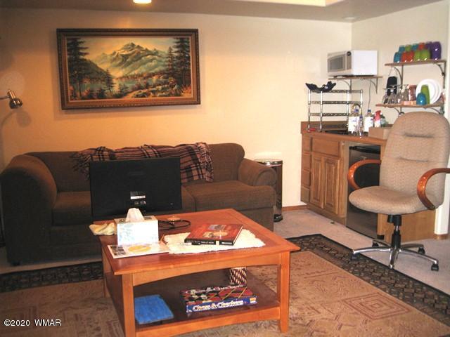 1922 Artist Draw Road Heber, AZ 85928 - Photo 47 of 63 a living room with furniture a rug and a wall painting