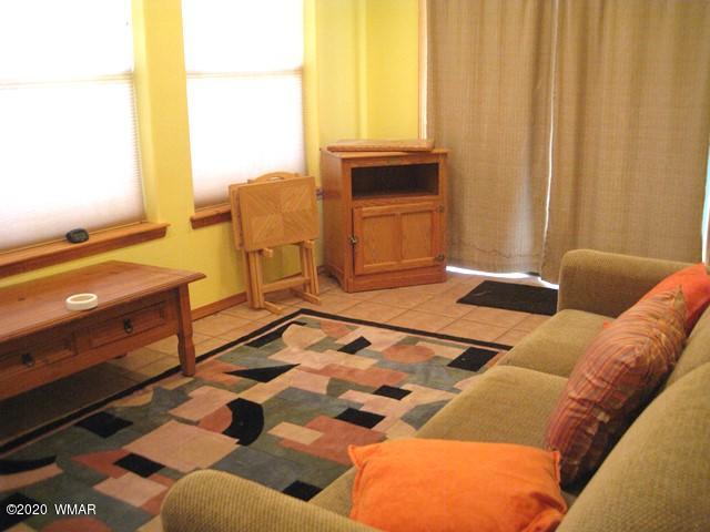 1922 Artist Draw Road Heber, AZ 85928 - Photo 50 of 63 a living room with a couch and a dining table