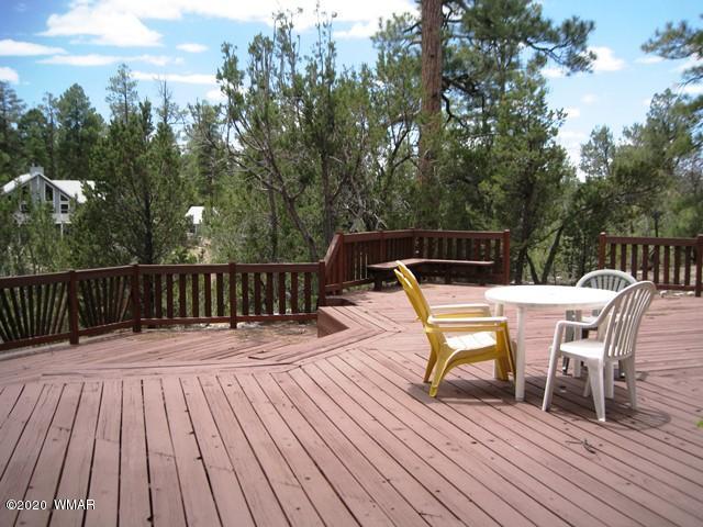 1922 Artist Draw Road Heber, AZ 85928 - Photo 53 of 63 a view of a deck with table and chairs and wooden floor