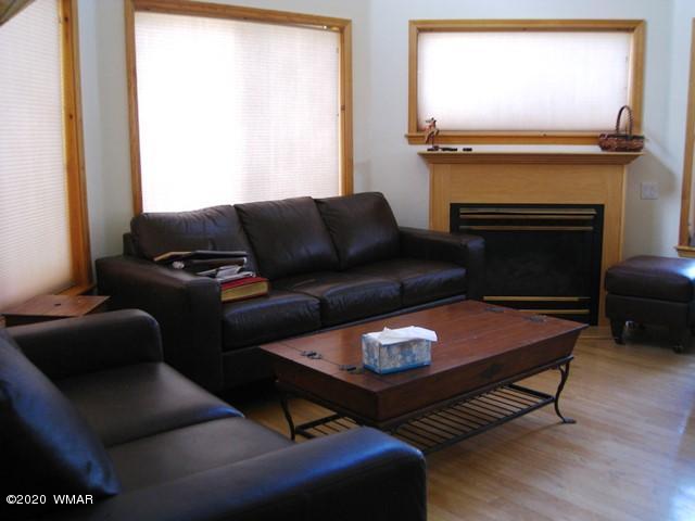 1922 Artist Draw Road Heber, AZ 85928 - Photo 9 of 63 a living room with furniture a fireplace and a flat screen tv