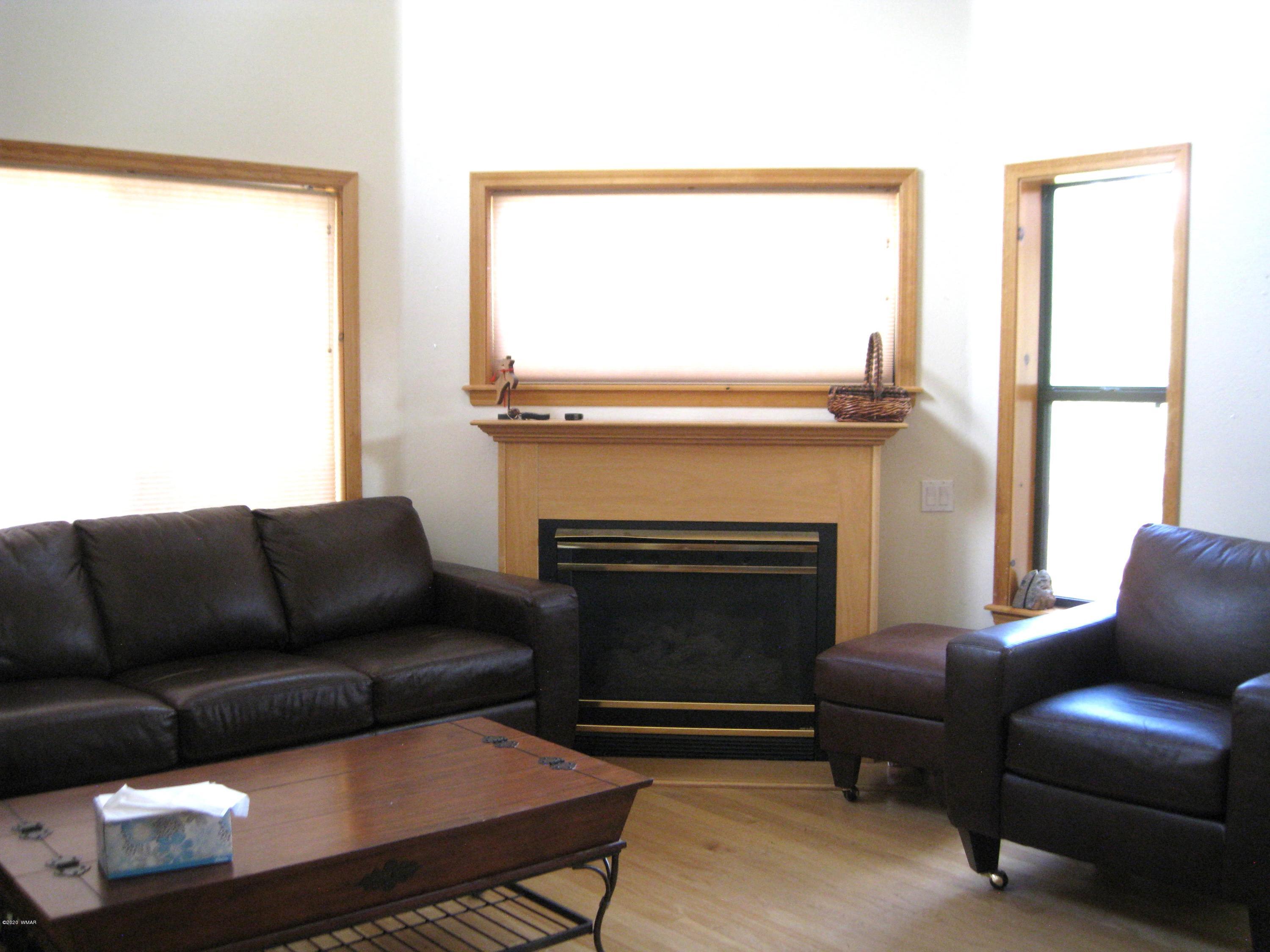 1922 Artist Draw Road Heber, AZ 85928 - Photo 10 of 63 a living room with a couch and a fireplace