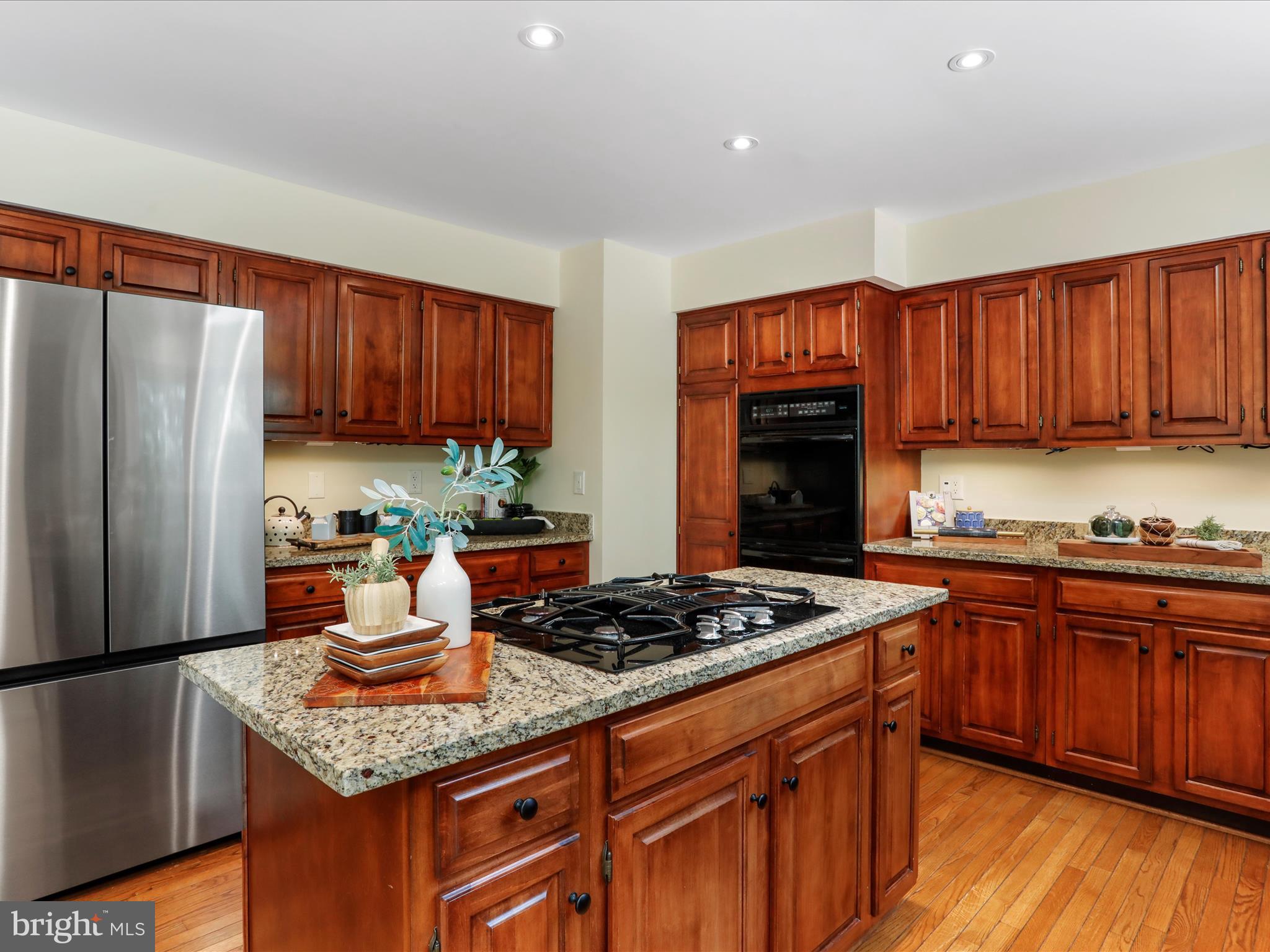 1350 Hunter Mill Road Reston, VA 20190 - Photo 14 of 75 a kitchen with stainless steel appliances granite countertop a stove refrigerator and a sink