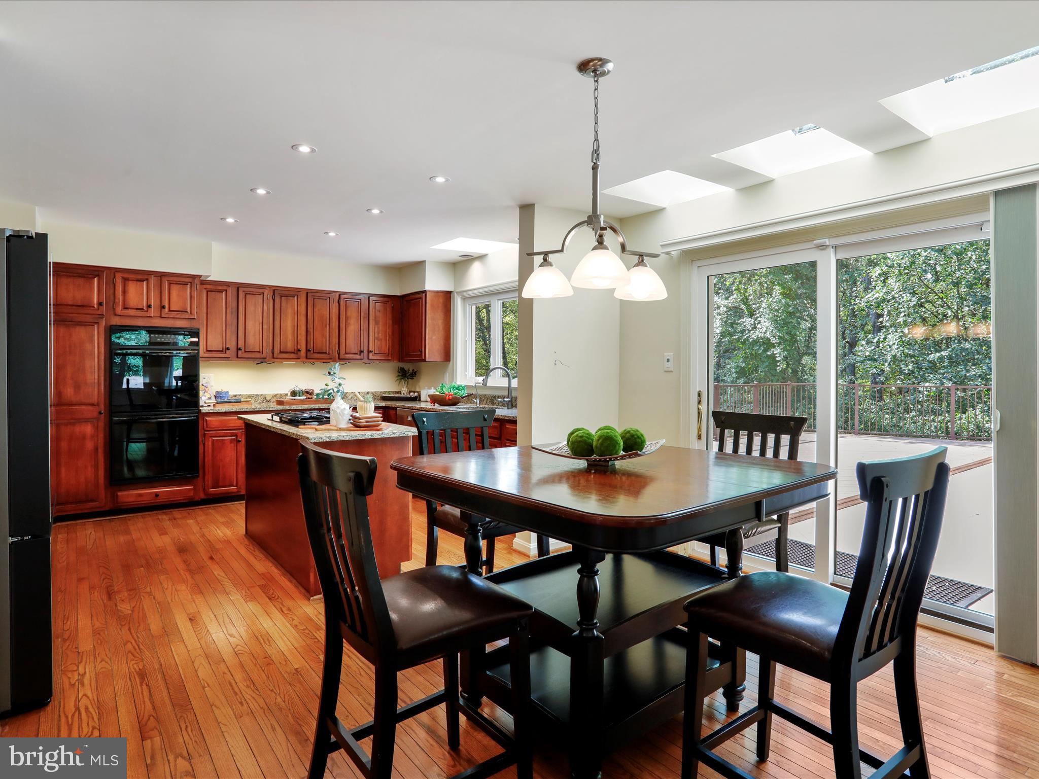 1350 Hunter Mill Road Reston, VA 20190 - Photo 16 of 75 a view of a dining room with furniture window and outside view