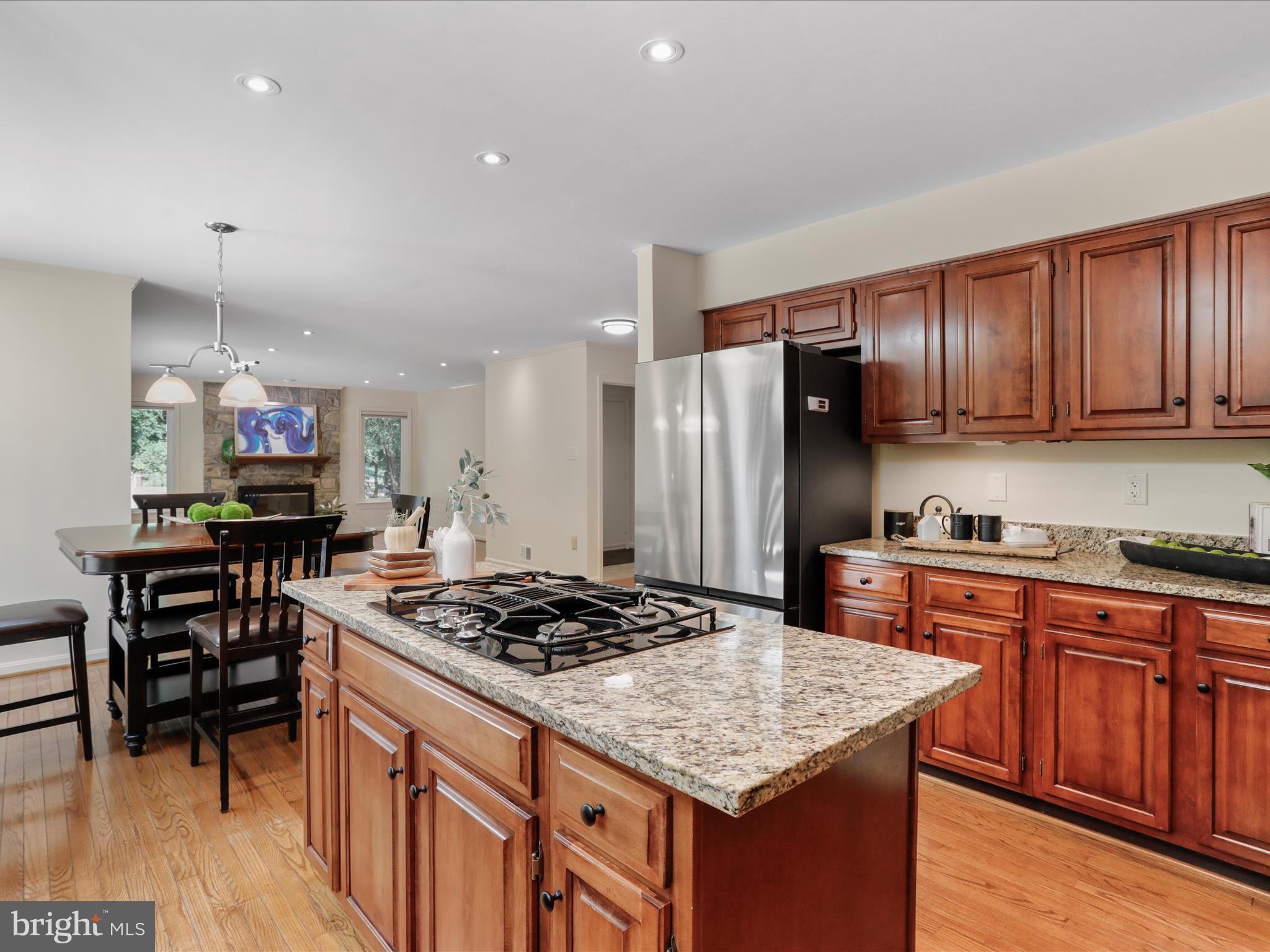 1350 Hunter Mill Road Reston, VA 20190 - Photo 18 of 75 a kitchen with stainless steel appliances granite countertop a stove refrigerator and cabinets