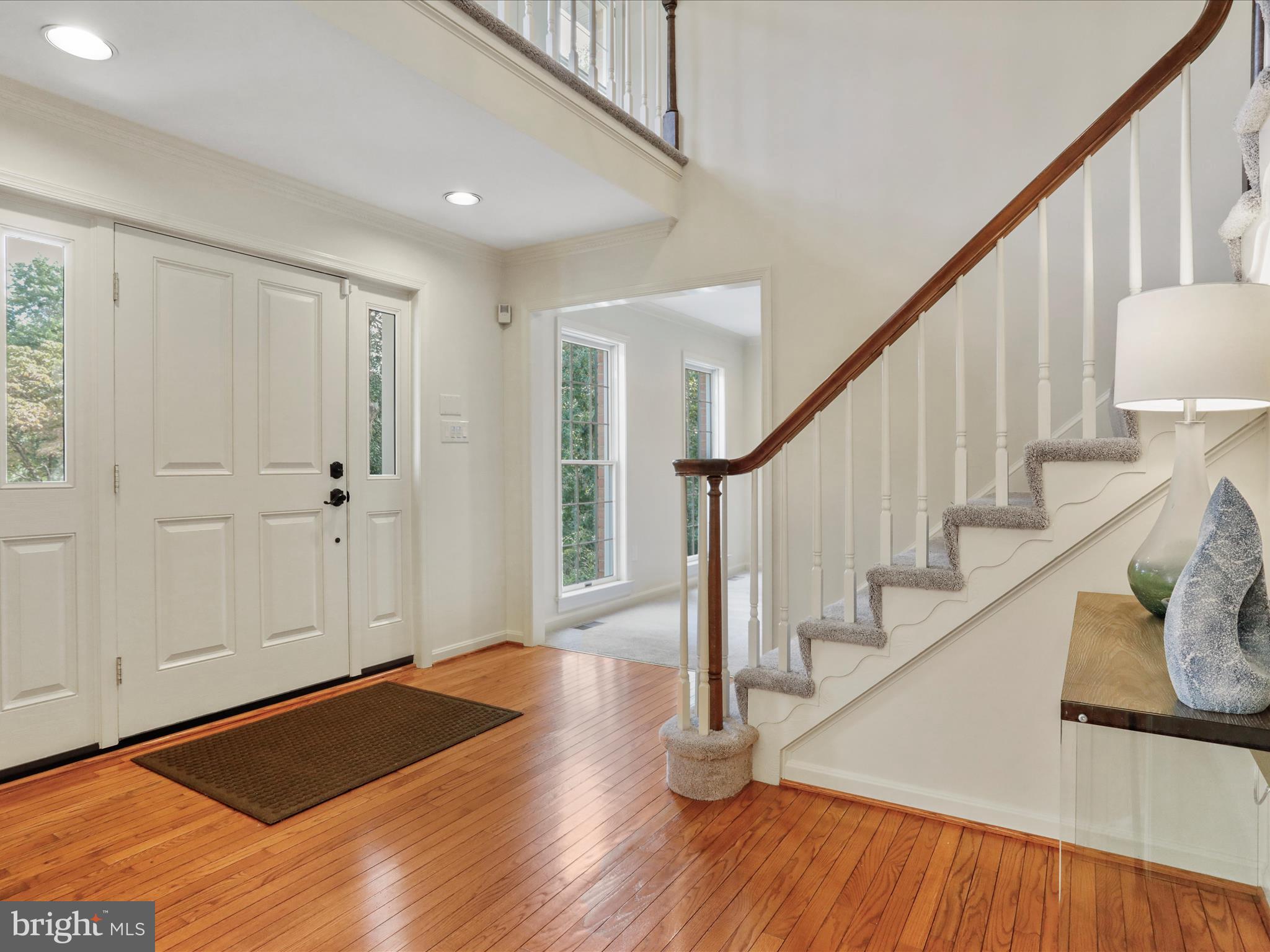1350 Hunter Mill Road Reston, VA 20190 - Photo 27 of 75 a view of front door with wooden floor and stairs