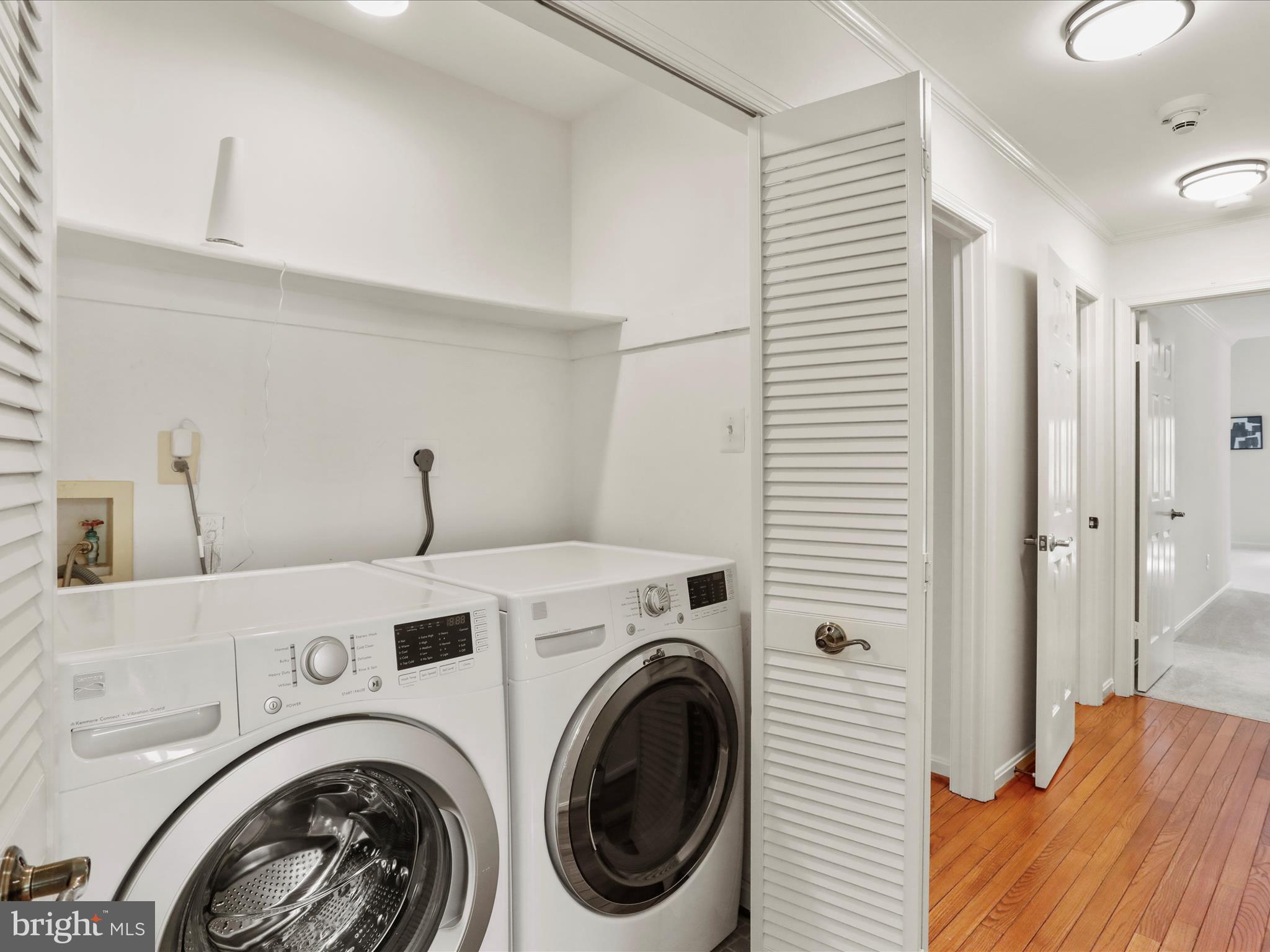 1350 Hunter Mill Road Reston, VA 20190 - Photo 29 of 75 a view of a hallway with washer and dryer
