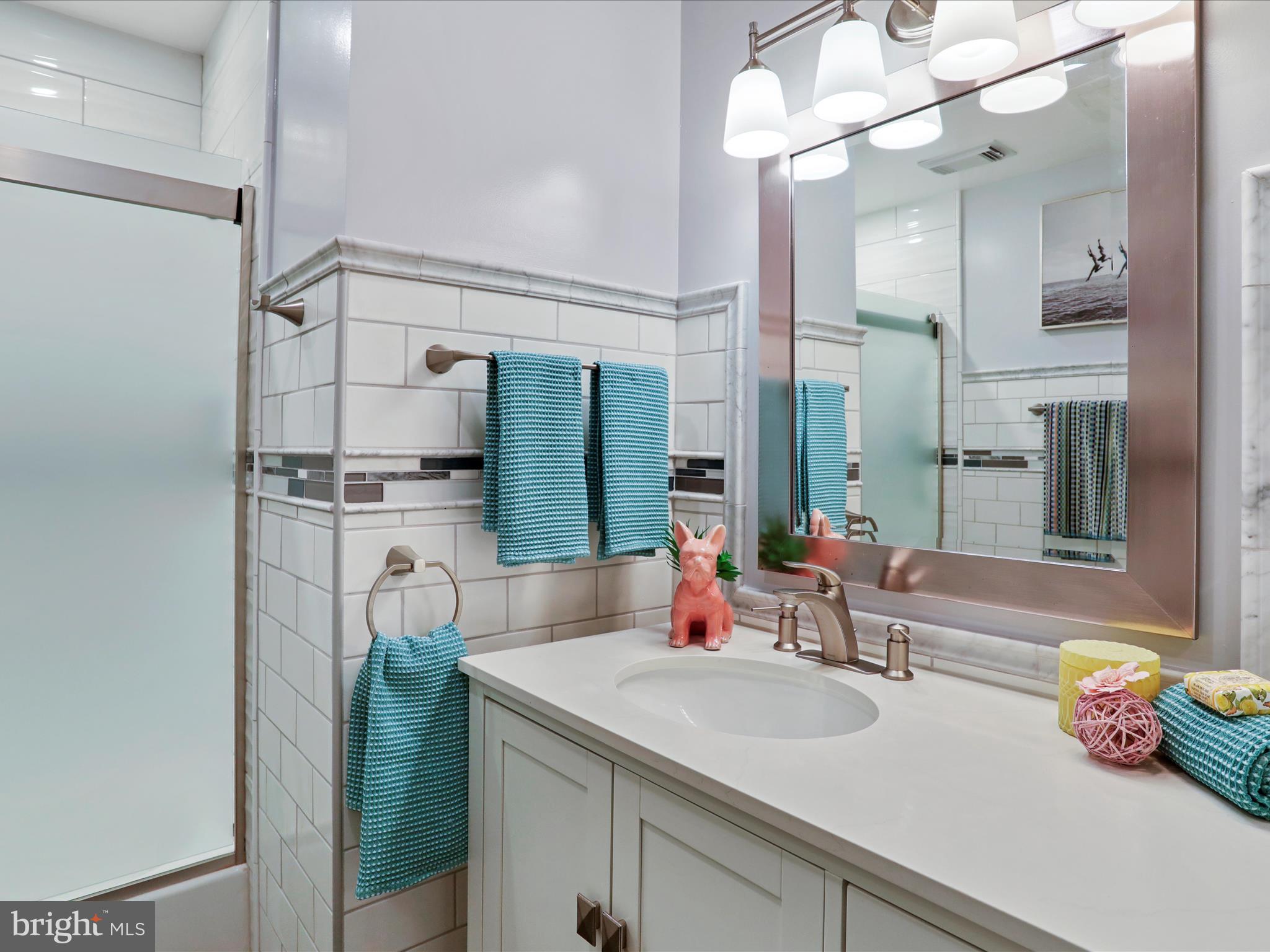 1350 Hunter Mill Road Reston, VA 20190 - Photo 46 of 75 a bathroom with a sink and a mirror