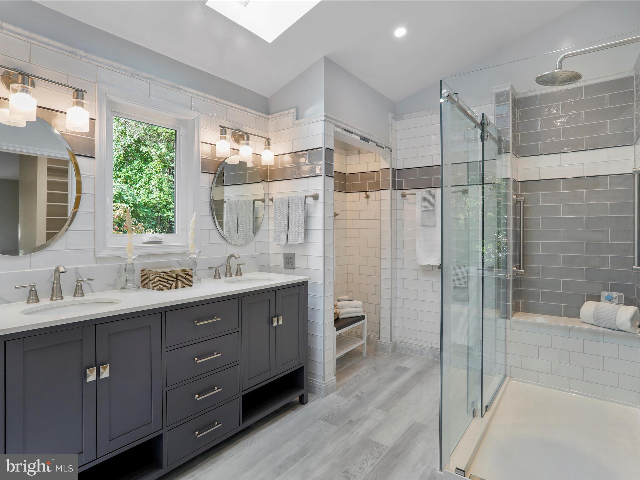 1350 Hunter Mill Road Reston, VA 20190 - Photo 5 of 75 a bathroom with a double vanity sink toilet mirror and shower