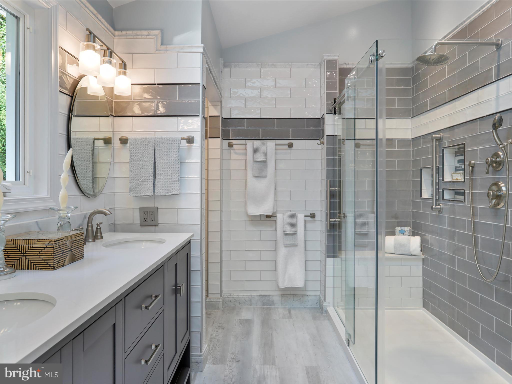 1350 Hunter Mill Road Reston, VA 20190 - Photo 6 of 75 a bathroom with a double vanity sink mirror and shower