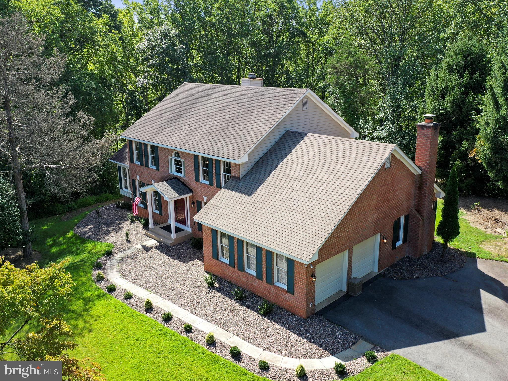 1350 Hunter Mill Road Reston, VA 20190 - Photo 72 of 75 an aerial view of a house with porch yard outdoor seating and green space