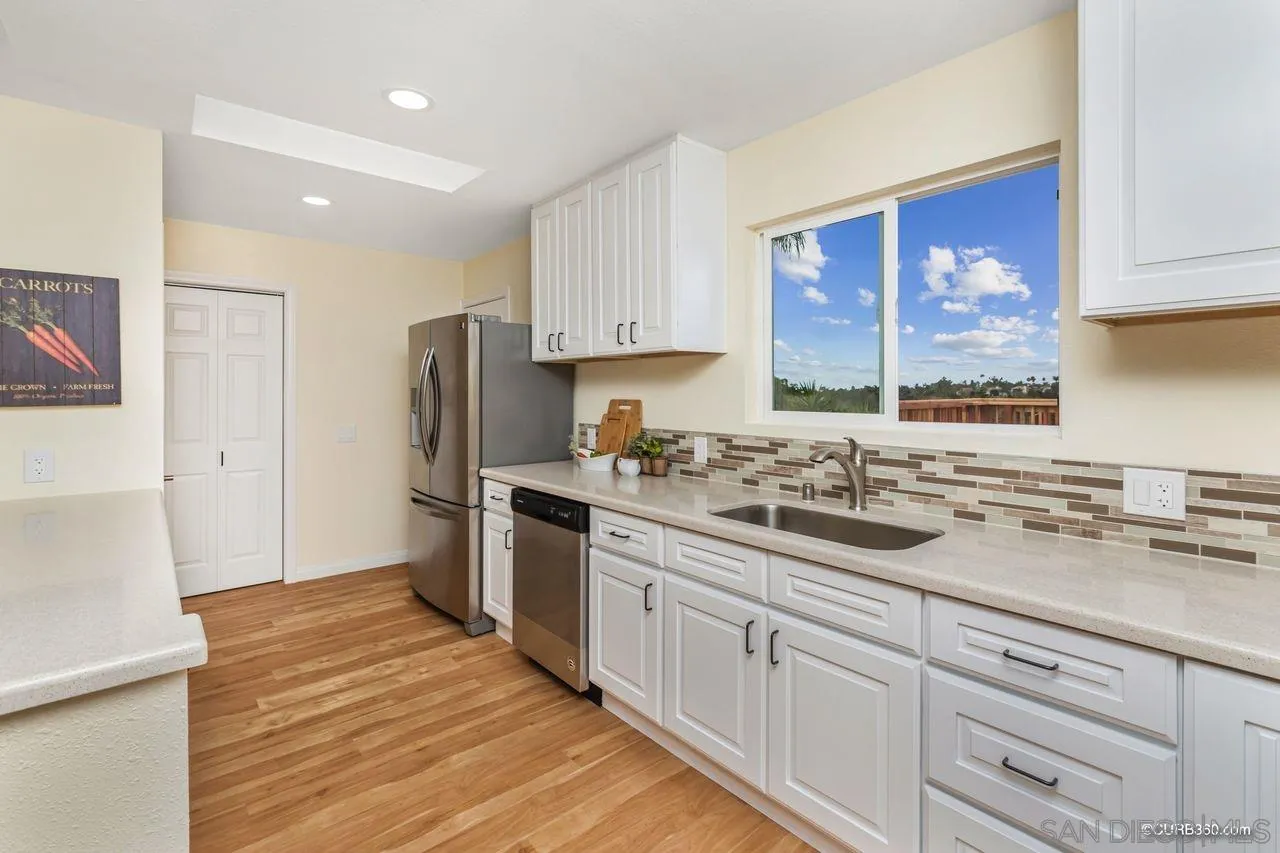 1427 Panorama Ridge Road Oceanside, CA 92056 - Photo 12 of 33 a kitchen with a sink stove and refrigerator