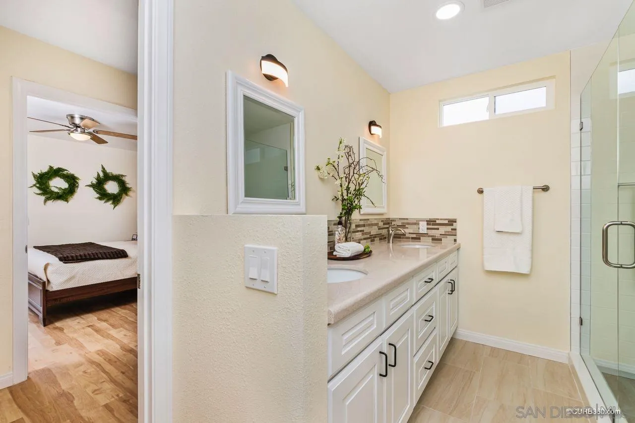 1427 Panorama Ridge Road Oceanside, CA 92056 - Photo 18 of 33 a bathroom with a sink and a mirror