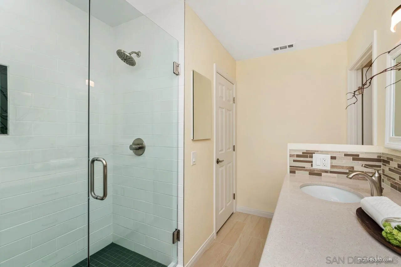 1427 Panorama Ridge Road Oceanside, CA 92056 - Photo 20 of 33 a bathroom with a sink a toilet and shower