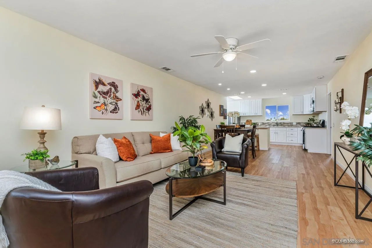 1427 Panorama Ridge Road Oceanside, CA 92056 - Photo 4 of 33 a living room with furniture and kitchen view