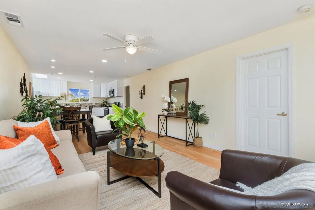 1427 Panorama Ridge Road Oceanside, CA 92056 - Photo 5 of 33 a living room with furniture and a potted plant