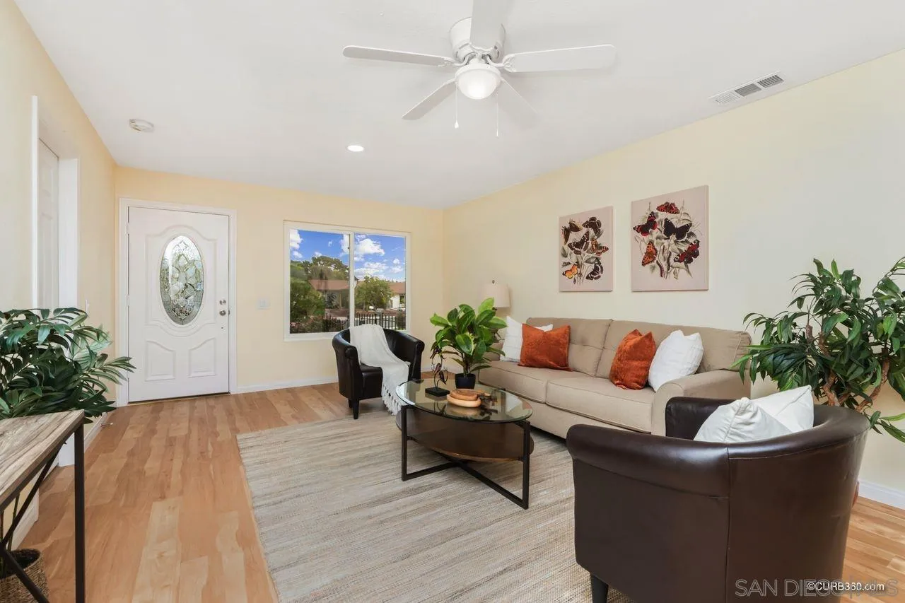 1427 Panorama Ridge Road Oceanside, CA 92056 - Photo 6 of 33 a living room with furniture and a potted plant