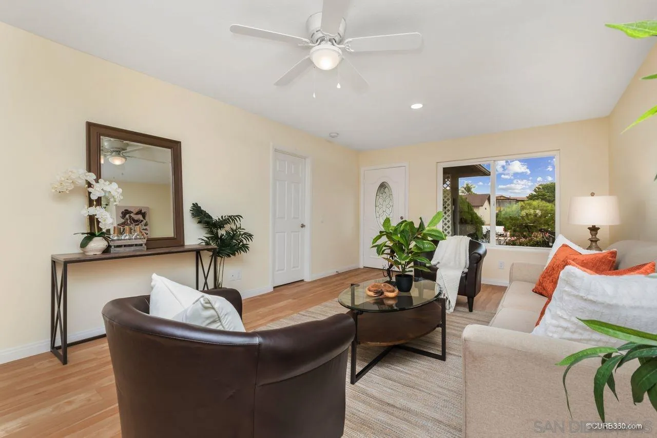 1427 Panorama Ridge Road Oceanside, CA 92056 - Photo 7 of 33 a living room with furniture and a potted plant