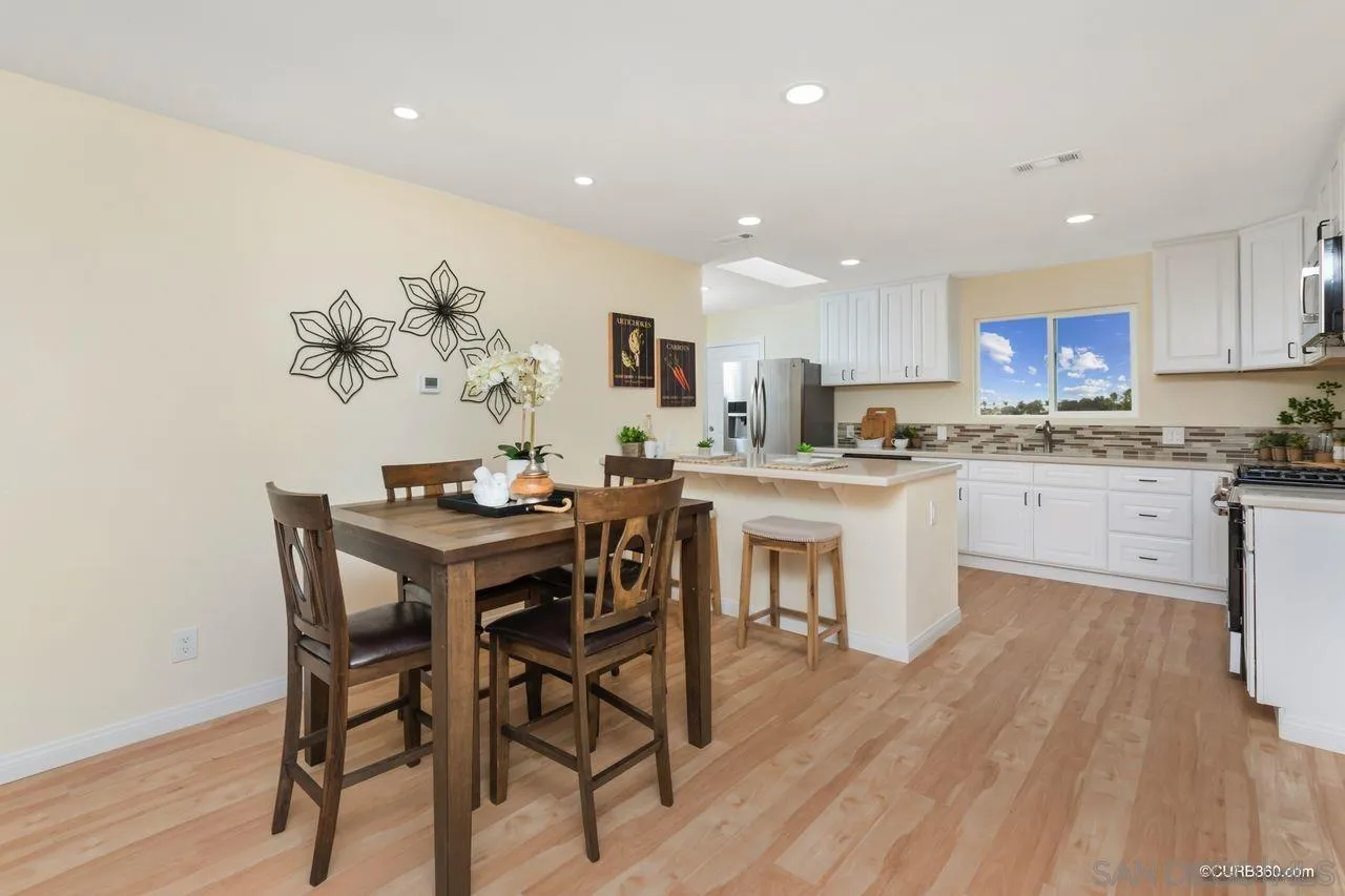 1427 Panorama Ridge Road Oceanside, CA 92056 - Photo 8 of 33 a kitchen with a table and chairs in it