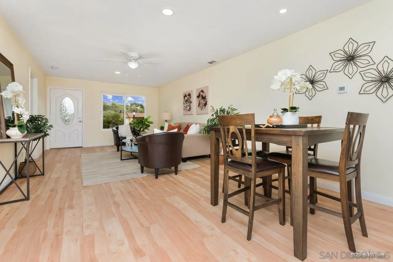 1427 Panorama Ridge Road Oceanside, CA 92056 - Photo 9 of 33 a view of a dining room with furniture and chandelier